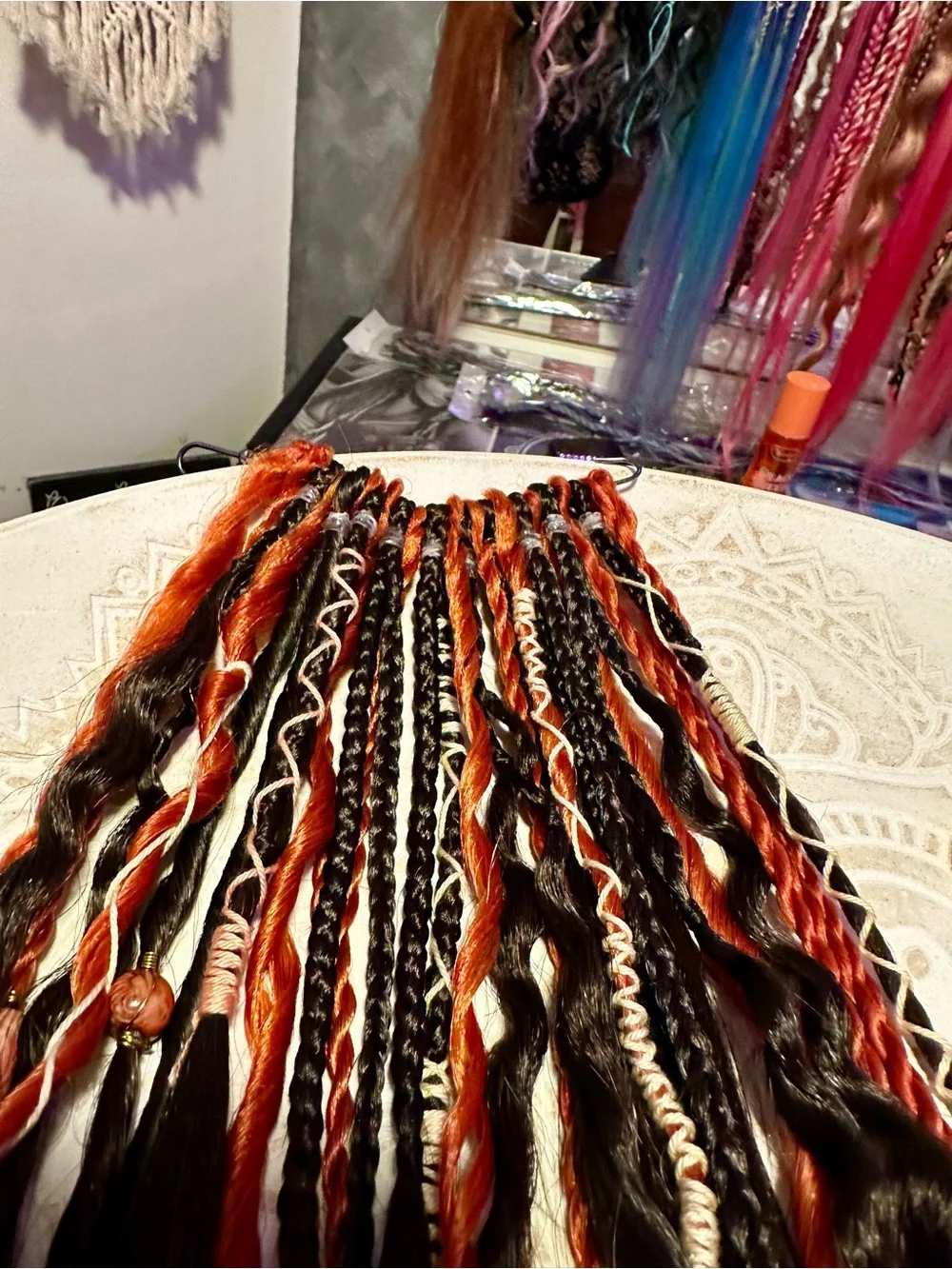 Blonde Hair Extensions with Black and Orange Braided Accents
